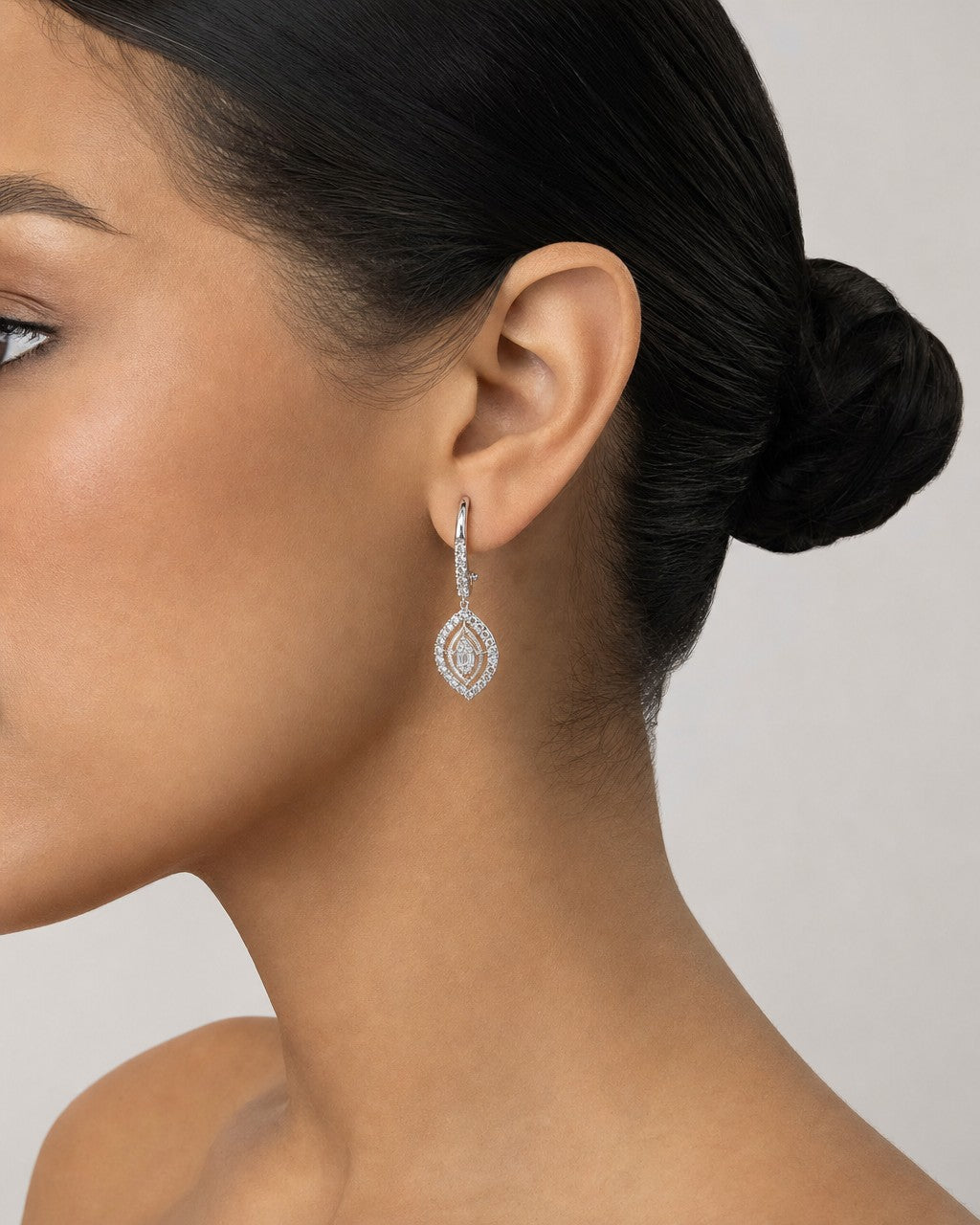 Female model wearing 14K Navette Diamond Dangling Earrings