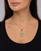 Female model wearing 14K Heart Hamsa Diamond Pendant