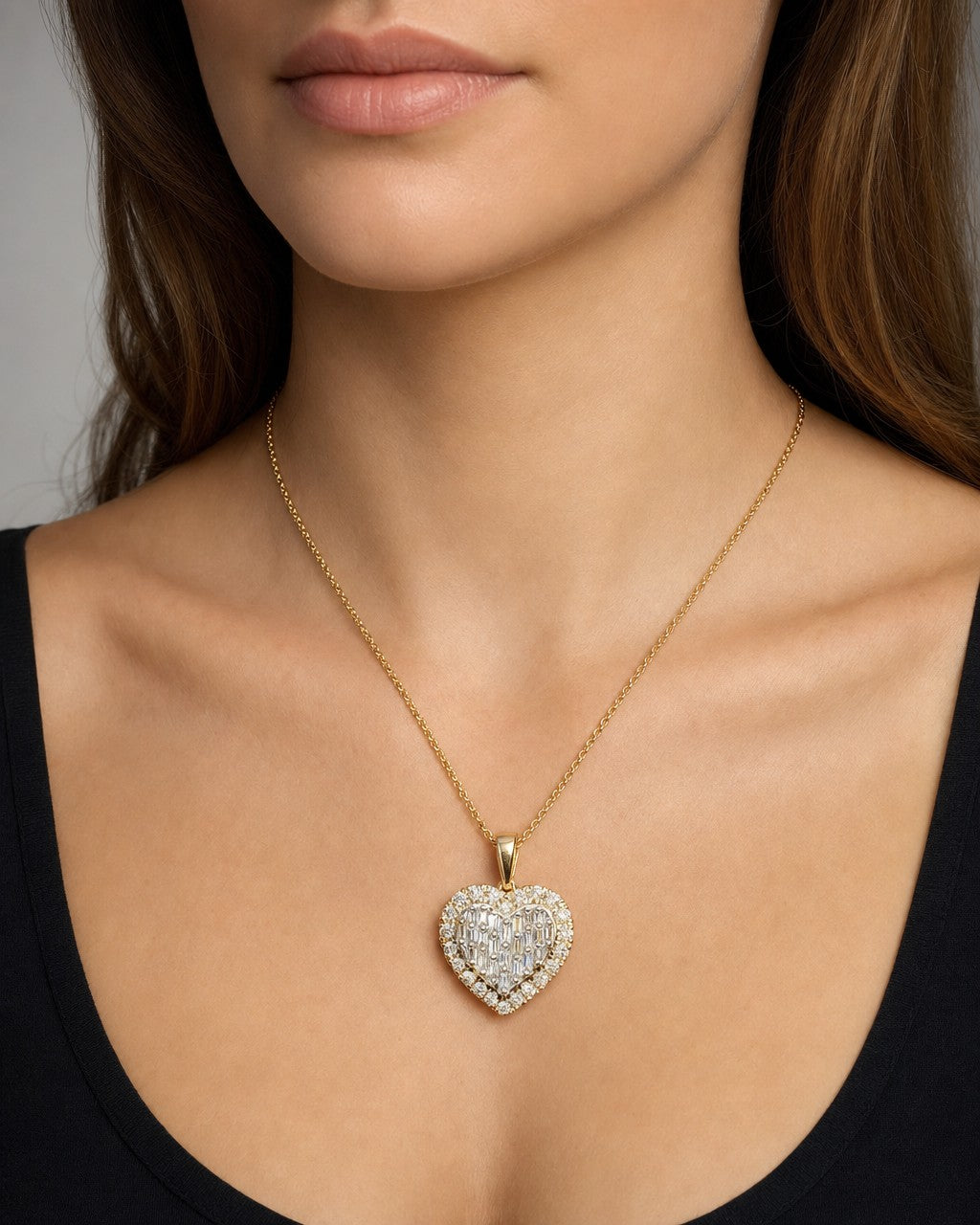 Female model wearing 14K Baguette Heart with Pave Diamond Halo Pendant