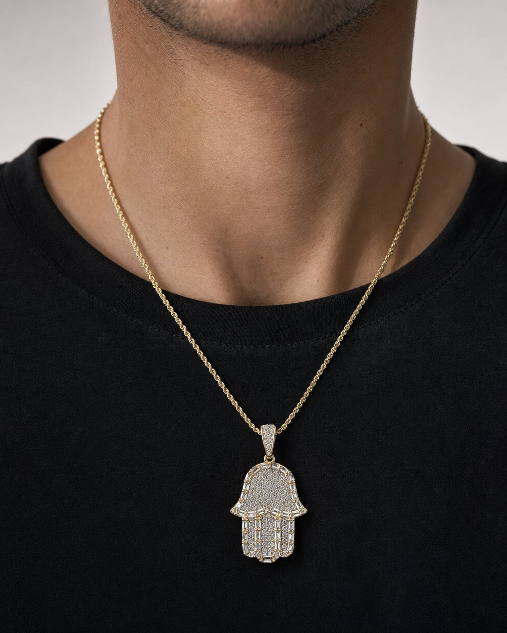 Male model wearing 14K Hamsa Halo Diamond Baguette Pendant