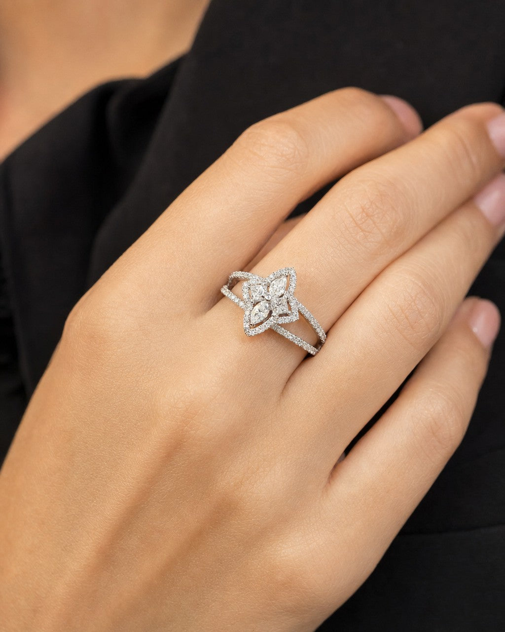 Female model wearing 18K Floral Halo Diamond Ring