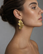 Female model wearing 18K Paradise Leaf Earrings