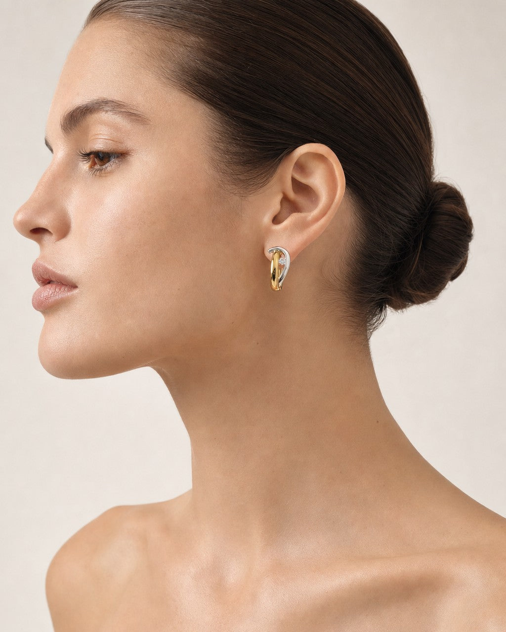 Female model wearing 18K Divine Two-Tone Diamond Earrings
