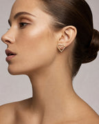 Female model wearing 14K Love Planet Heart Diamond Earrings