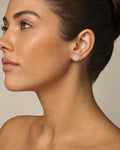 Female model wearing 14K Jumbo Circle Flower Halo Diamond Baguette Earrings