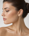 Female model wearing 14K Heart Infinity Diamond Earrings