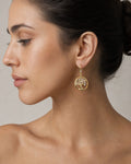 Female model wearing 14K Tree of Life Hoop Earrings