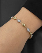 Male model wearing 14K 5.5MM Two-Tone Flat Ball Link Bracelet 7"