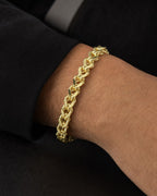 Male model wearing 14K 6.3MM Franco Box Cuban Link Bracelet 8.5"