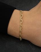 Male model wearing 14K 4MM Oval Link Bracelet 7.5"