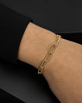 Male model wearing 14K Oval Flat Link Bracelet 7"