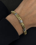 Male model wearing 10K 5.5MM Two-Tone Braided Bracelet 7"