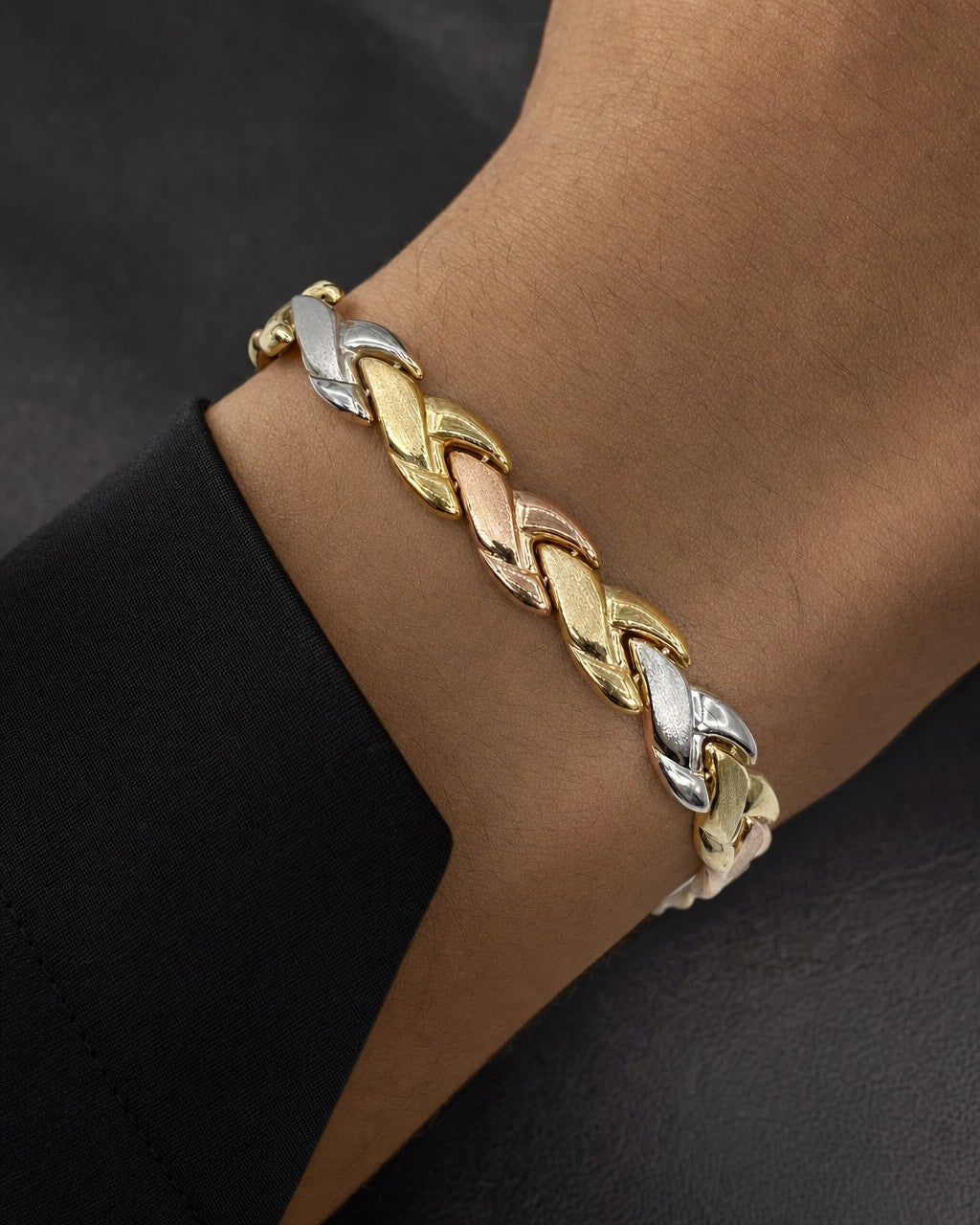 Male model wearing 10K 6.5MM Tri-Tone Braid Bracelet 7"