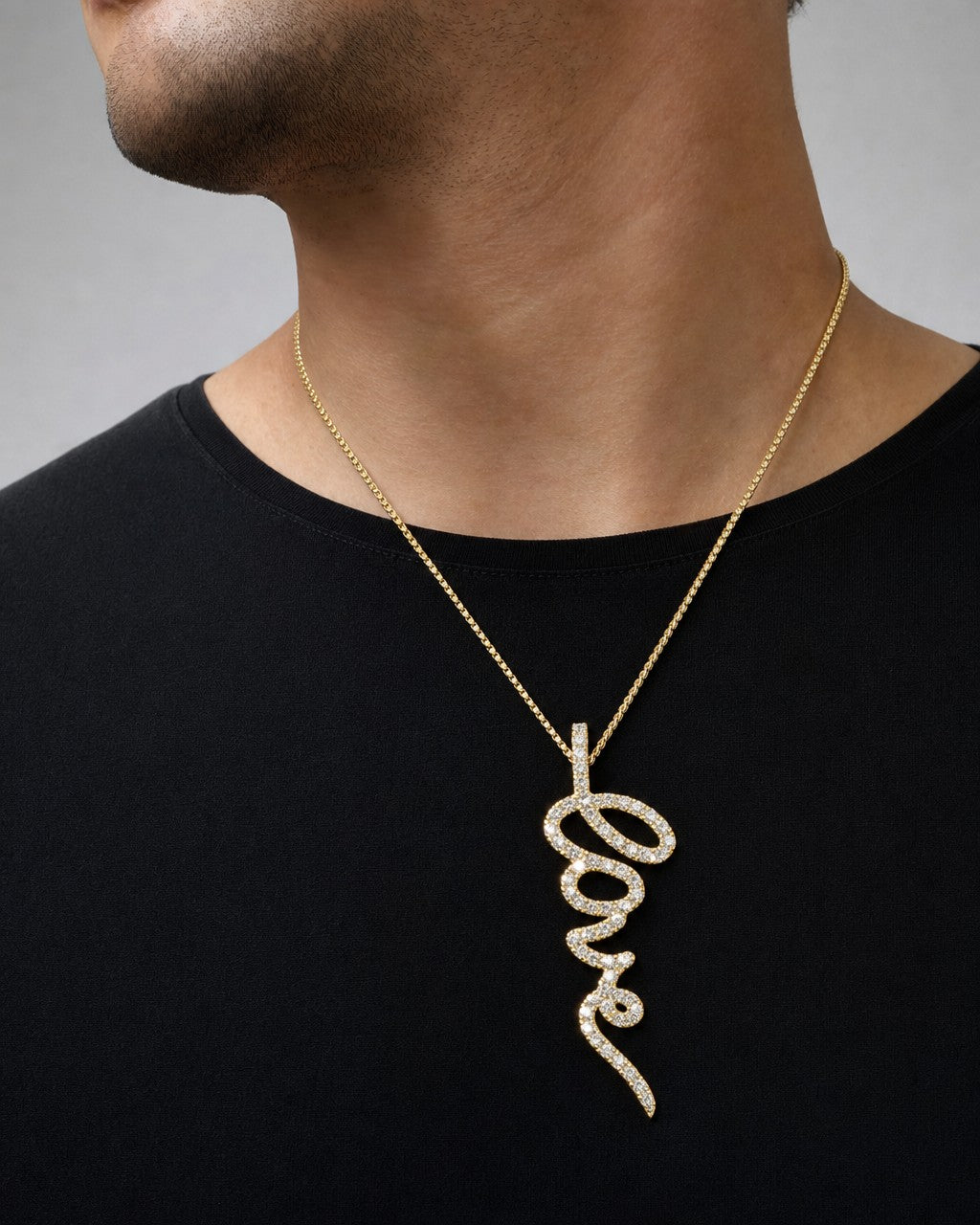 Male model wearing 10K Love Script Diamond Pendant
