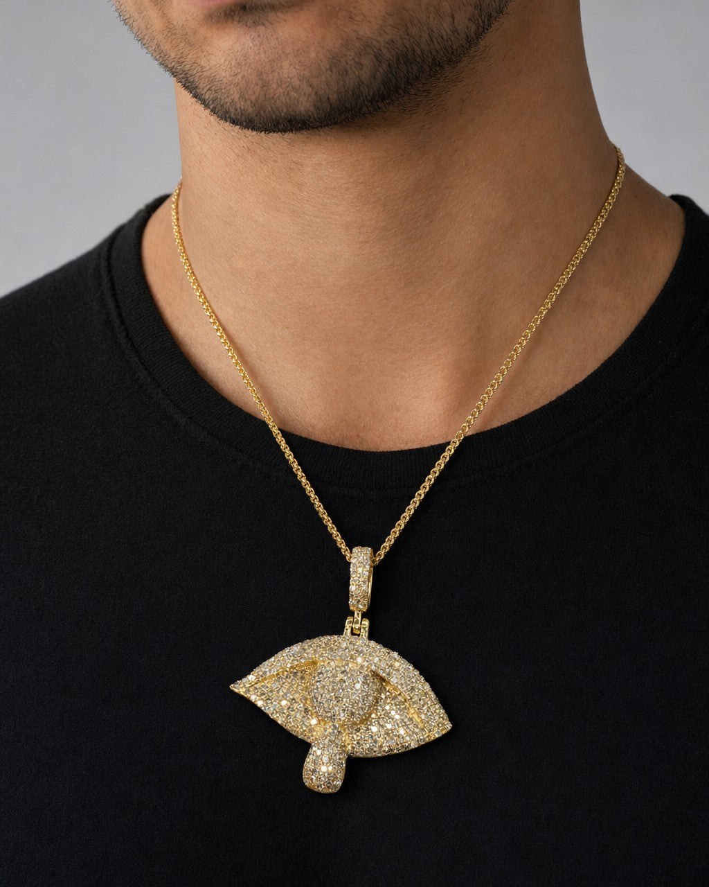 Male model wearing 10K Eye Teardrop Diamond Pendant