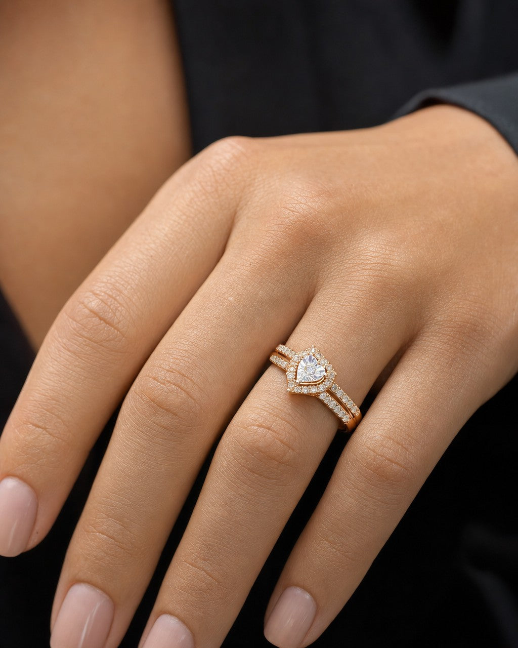 Female model wearing 10K Heart Halo Diamond Ring