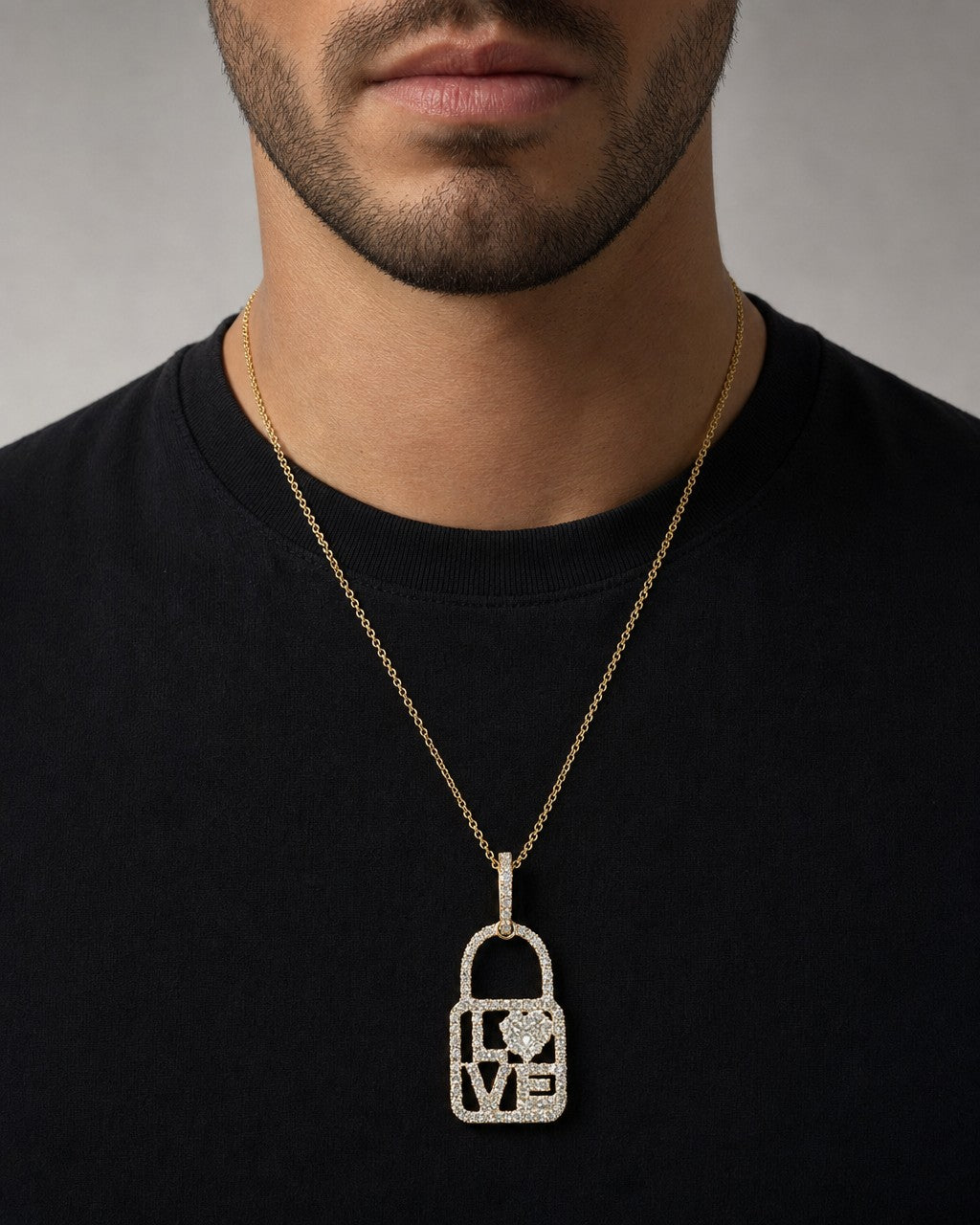 Male model wearing 14K Love Lock Diamond Pendant