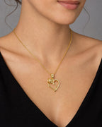 Female model wearing 14K Rose Heart Diamond Pendant