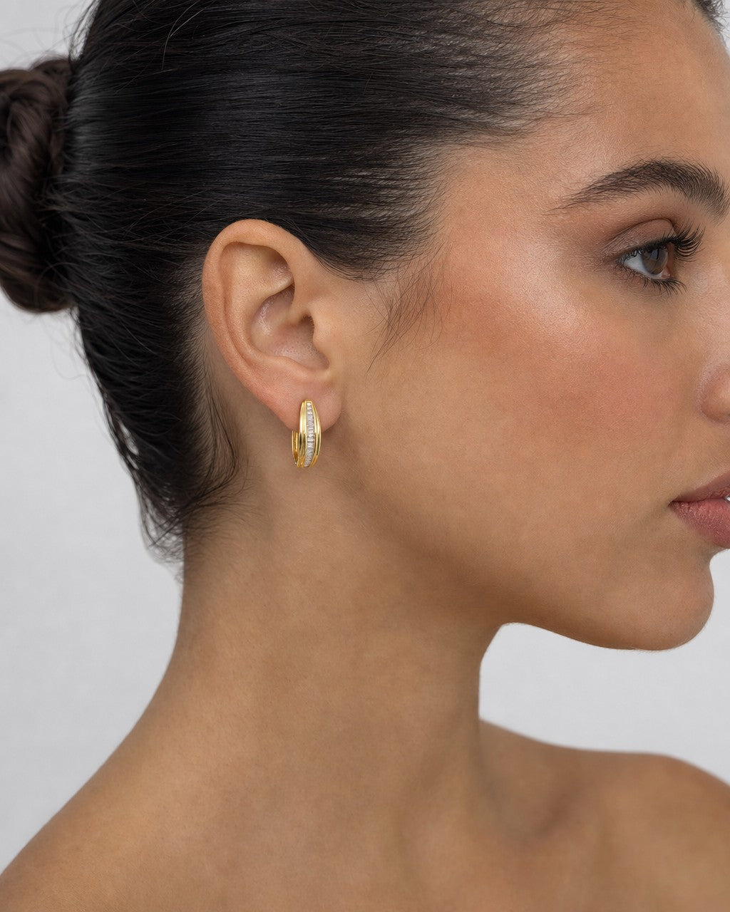 Female model wearing 14K Diamond Baguette Hoop Earrings