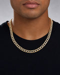 Male model wearing 14K 6.5MM Two-Tone Flat Cuban Link Chain 18"