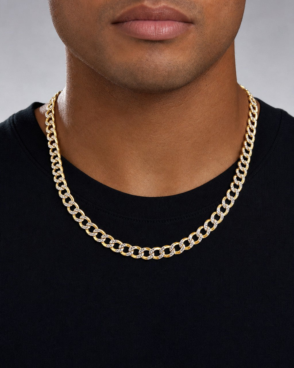 Male model wearing 14K 6.5MM Two-Tone Flat Cuban Link Chain 18"