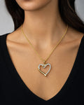 Female model wearing 10K Ribbon Heart Diamond Pendant Necklace