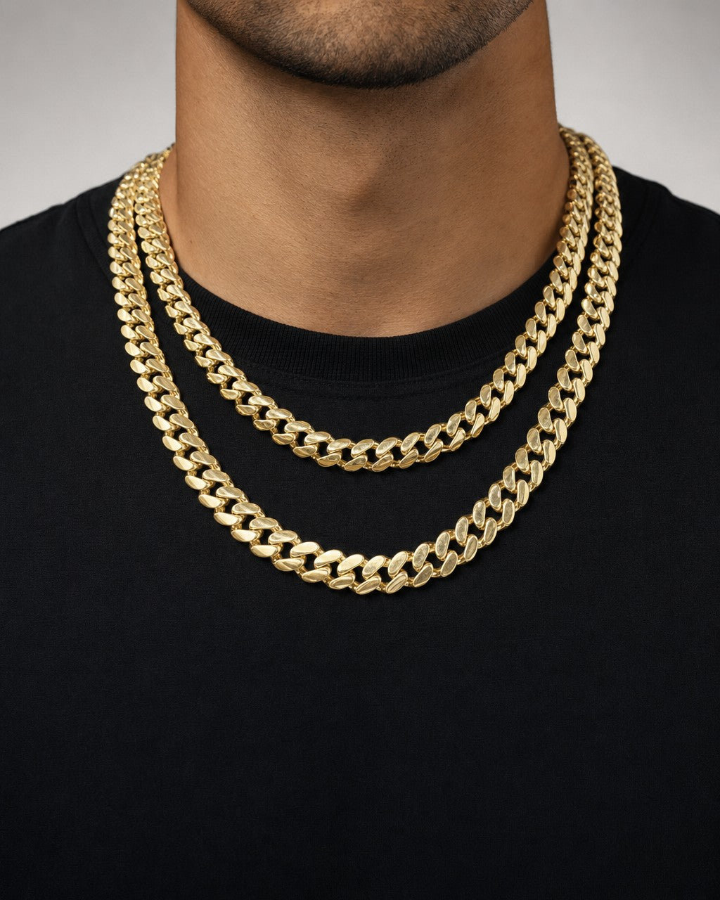 Male model wearing 14K 8MM Cuban Link Chain 16-20"