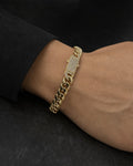Male model wearing 14K 7MM Cuban Link Bracelet 7"