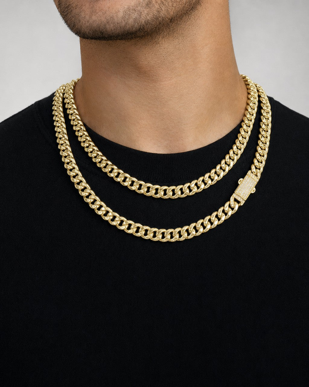 Male model wearing 14K 7MM Cuban Link Chain 16-18"