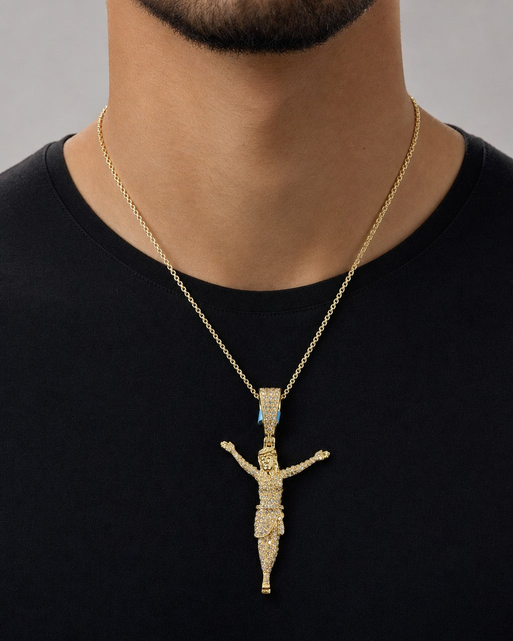 Male model wearing 14K Crucified Jesus Diamond Pendant