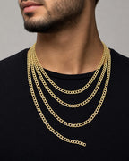 Male model wearing 14K 5.5MM Two Tone Cuban Link Chain 18-24"