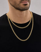 Male model wearing 10K Gold 5MM Cuban Link Chain 16-24"