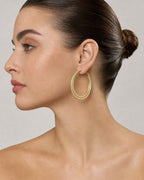 Female model wearing 14K Alligator Textured Gold Hoop Earrings 3.5MM
