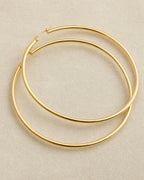14K 2MM Gold Hoop Earrings styled photo