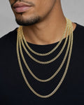 Male model wearing 4.8MM Two-Tone Flat Cuban Link Chain 16-26"