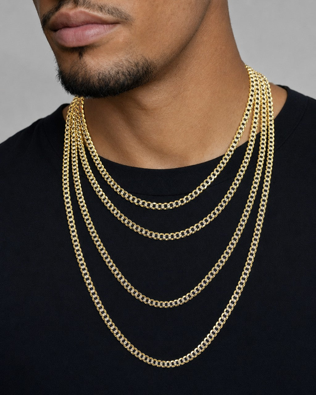 Male model wearing 4.8MM Two-Tone Flat Cuban Link Chain 16-26"