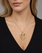 Female model wearing 10K Ribbon Heart in Rose Gold Diamond Baguette Pendant
