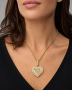 Female model wearing 14K Jumbo Heart Halo Diamond Baguette Pendant