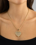 Female model wearing 14K Heart in Rose Gold Halo Diamond Pendant