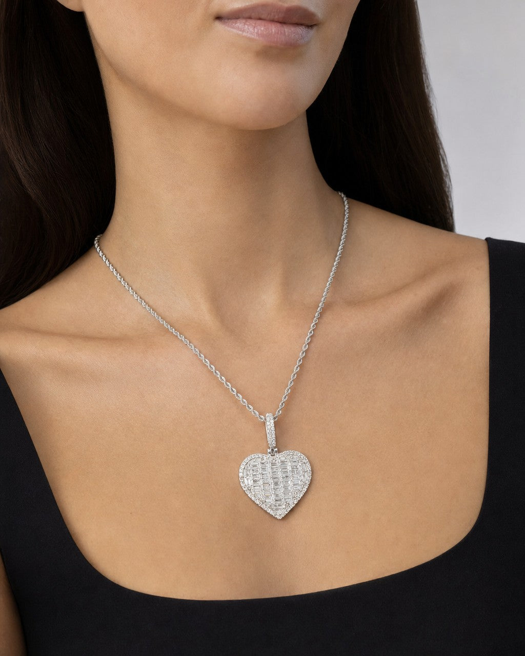 Female model wearing 14K Heart Halo Diamond Baguette Pendant