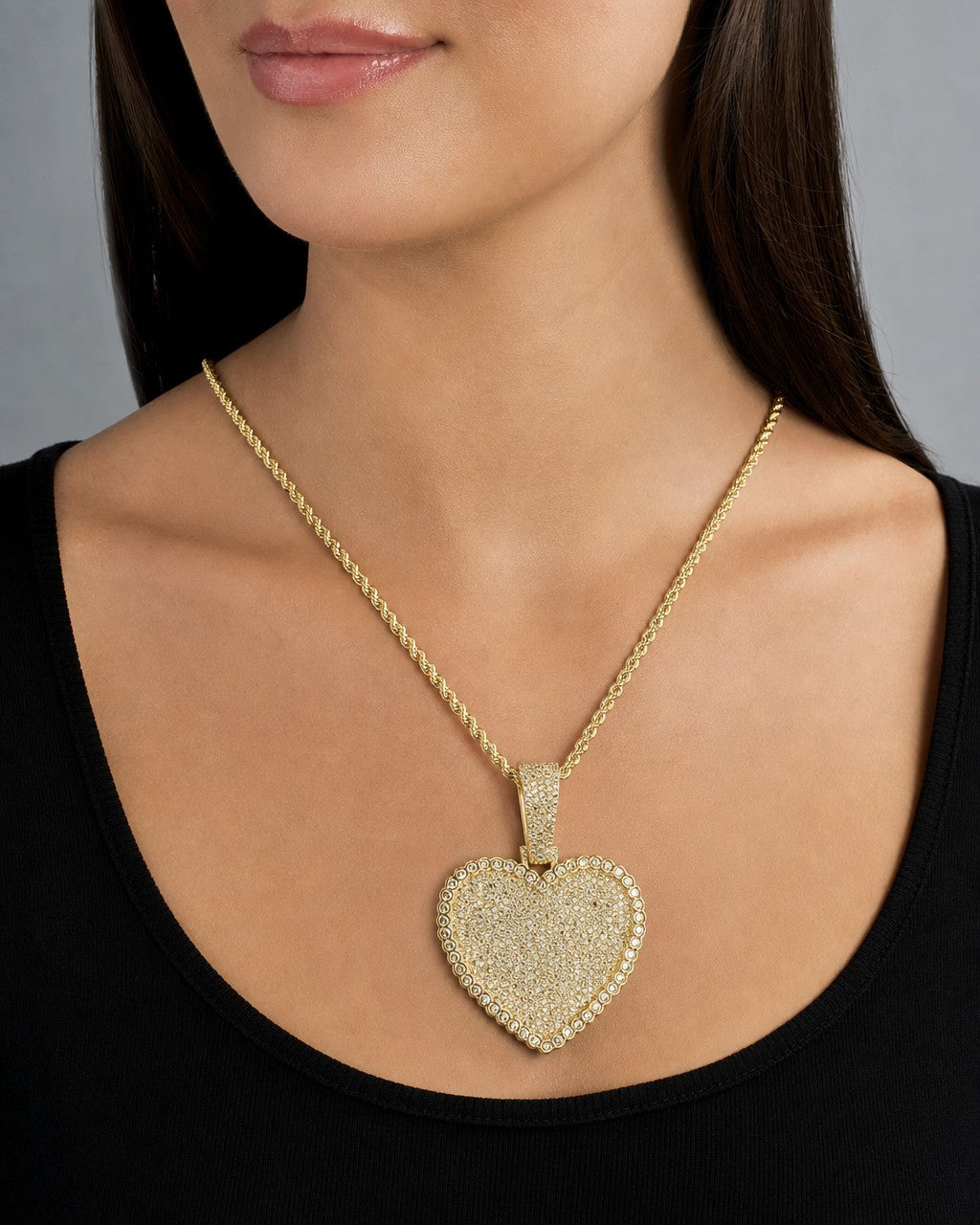 Female model wearing 14K Heart Pave Halo Diamond Pendant