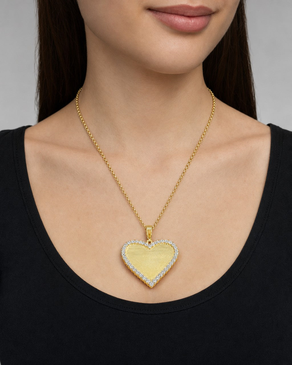 Female model wearing 10K Adore Heart Diamond Photo Pendant