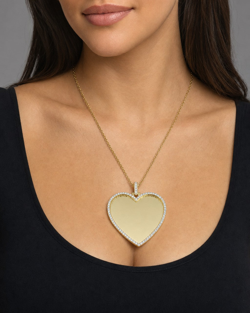 Female model wearing 10K Amore Heart Diamond Pendant