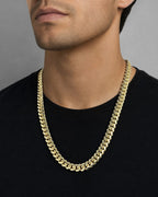 Male model wearing 14K 9.5MM Cuban Link Chain 22"