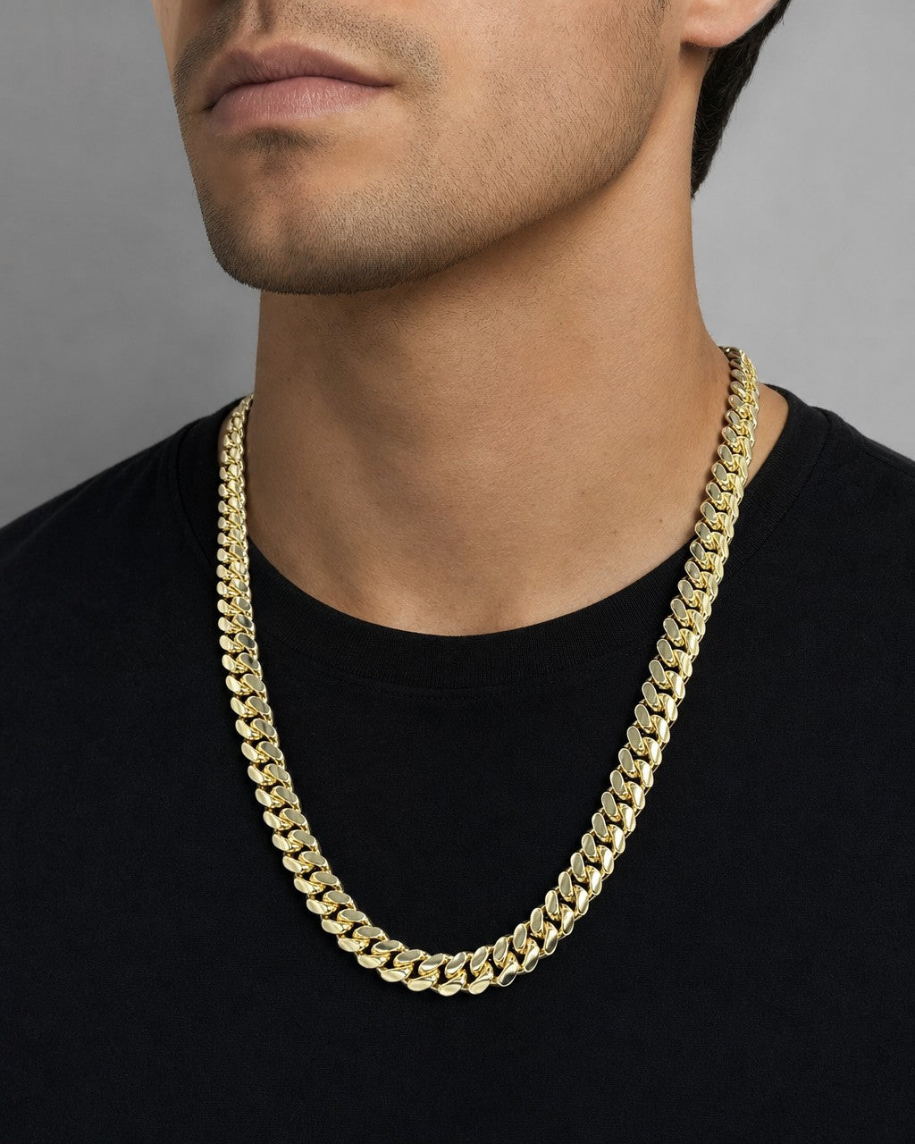 Male model wearing 14K 9.5MM Cuban Link Chain 22"