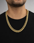 Male model wearing 14K 12.4MM Cuban Link Chain 24"