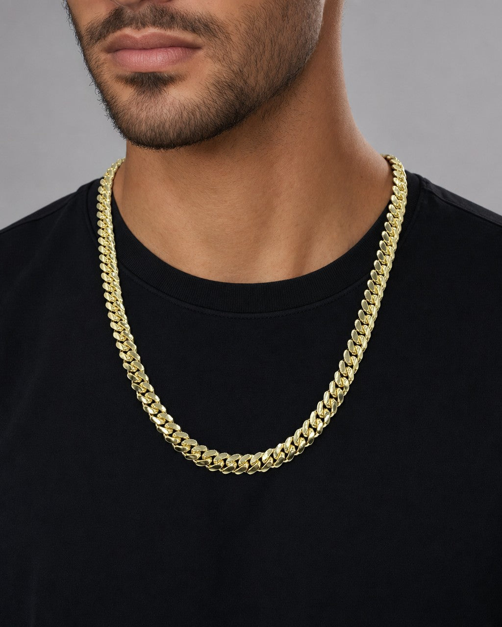 Male model wearing 14K 8.5MM Solid Cuban Link Chain 24"