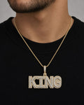 Male model wearing 10K King Name Plate Pendant