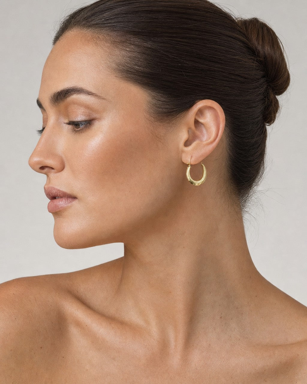 Female model wearing 14K Italy Hoop Earrings