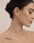 Female model wearing 14K Pleated Hoop Earrings